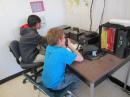 Bryce makes a contact on the local VHF repeater. [Sterling Coffey, N0SSC, photo] 