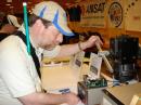 Ken, KB3LLA, checking out the azimuthal and elevation control on a satellite rotator at the AMSAT booth.