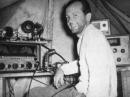 Bob Denniston, W0NWX, at the FO8AJ Clipperton Island shack. To his left is the Hallicrafters SX-88 receiver; behind him is the HT20 transmitter.