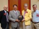 ARRL First Vice President Kay Craigie, N3KN, and Atlantic Division Director Bill Edgar,  N3LLR (far right), present Hiram Percy Maxim's, W1AW,  personal straight key to ARRL President Joel Harrison, W5ZN, and Chief Executive Officer David Sumner, K1ZZ (far left). [S. Khrystyne Keane, K1SFA, Photo]