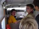 A very tired KU0DM (yellow shirt) demonstrates calling CQ during JOTA 2007 
inside of the county's SATERN trailer.
