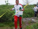 Valeri Georgiev runs up the 2 meter starting corridor followed by Ian Smith, a New England Orienteering Club member. Valeri learned ARDF in his native Bulgaria and now teaches it to others in Montreal, Quebec. Unfortunately, the ankle injury he suffered after finding one transmitter took him out of medal contention in these championships. 